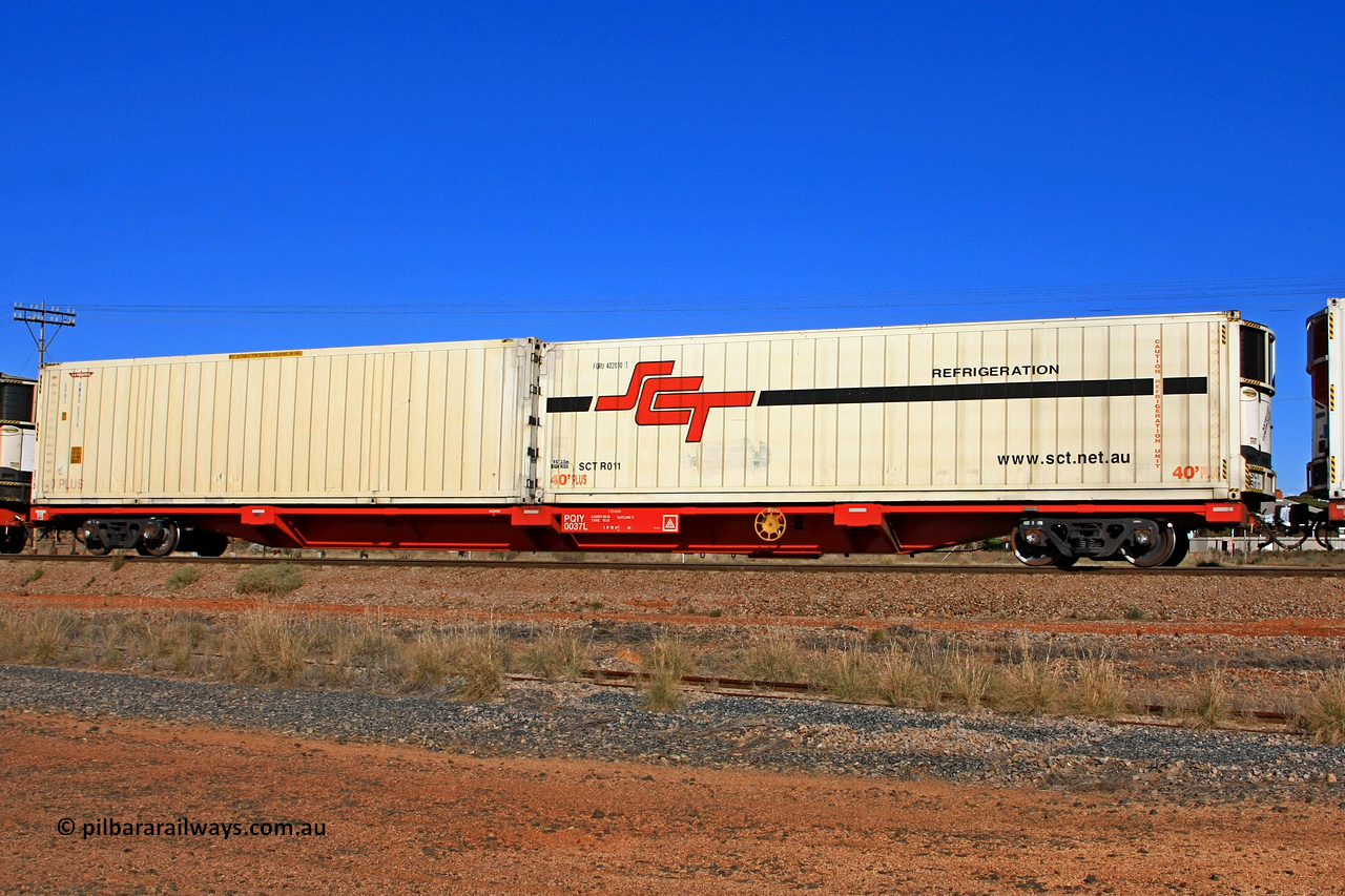 100603 9001
Parkeston, SCT train 3MP9, PQIY type 80' container flat PQIY 0037, one of forty units built by Gemco WA in 2009 loaded with 40' SCT Refrigeration reefer FORU 402010 [1] / SCTR011 and a 40' K+S Freighters GPR1 type reefer RWRU 0010.
Keywords: PQIY-type;PQIY0037;Gemco-WA;