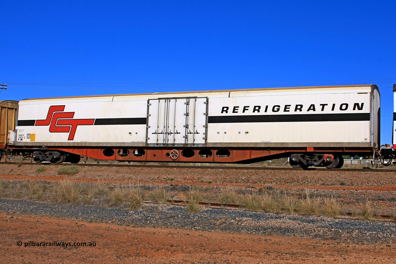 100603 9008
Parkeston, SCT train 3MP9, ARFY type ARFY 2402 refrigerated van with a Ballarat built Maxi-CUBE body mounted on an original Commonwealth Railways ROX container waggon built by Perry Engineering SA in 1971, recoded to AQOX, AQOY and RQOY before having the Maxi-CUBE refrigerated body added circa 1998 for SCT service.
Keywords: ARFY-type;ARFY2402;Maxi-Cube;Perry-Engineering-SA;ROX-type;AQOX-type;