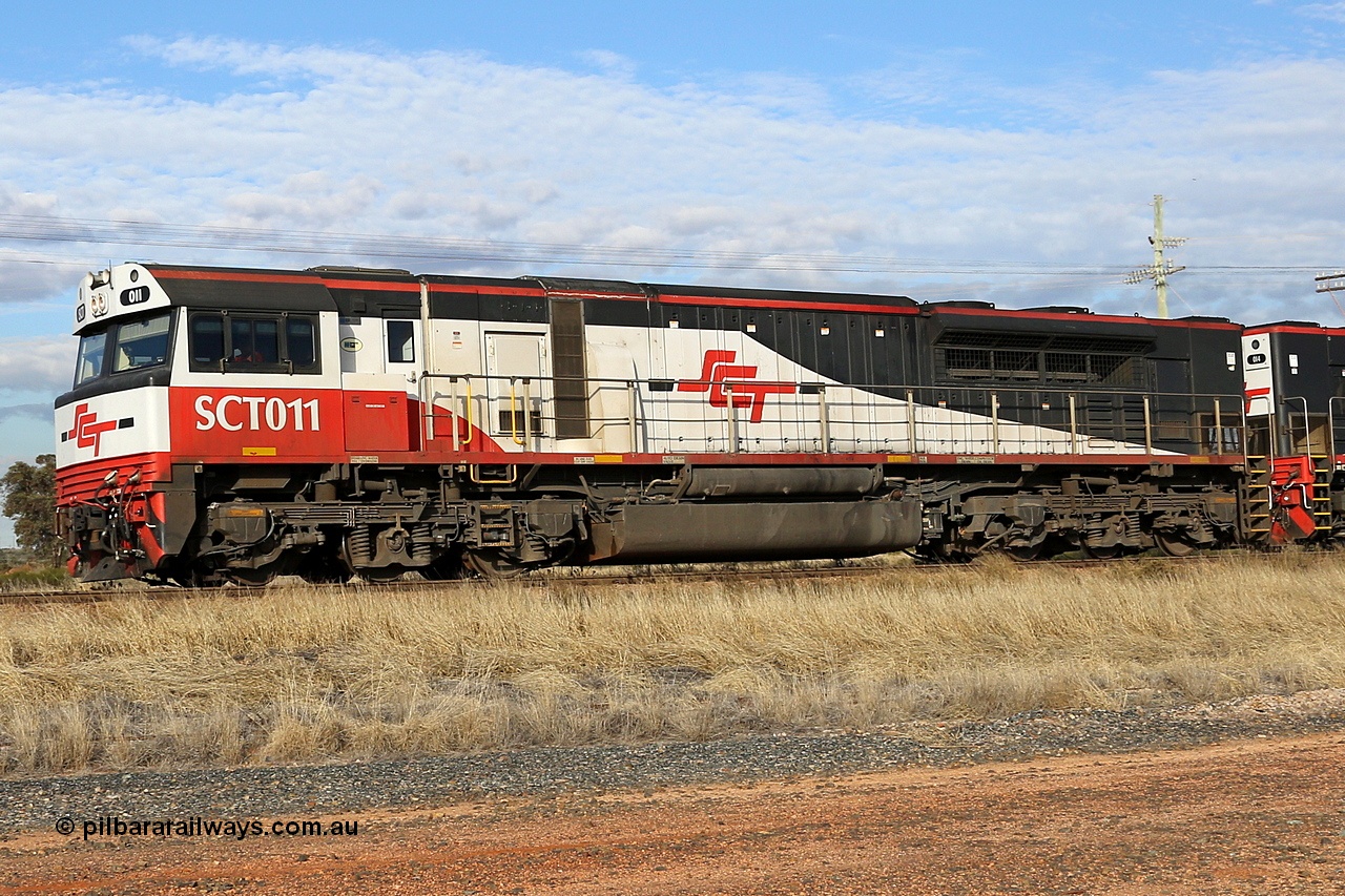 130710 1005
Parkeston, SCT train 3PG1 which operates from Perth to Parkes [Goobang Junction, NSW], SCT class SCT 011 serial 07-1735 lead unit is an EDI Downer built EMD model GT46C-ACe. Wednesday 10th of July 2013.
Keywords: SCT-class;SCT011;07-1735;EDI-Downer;EMD;GT46C-ACe;