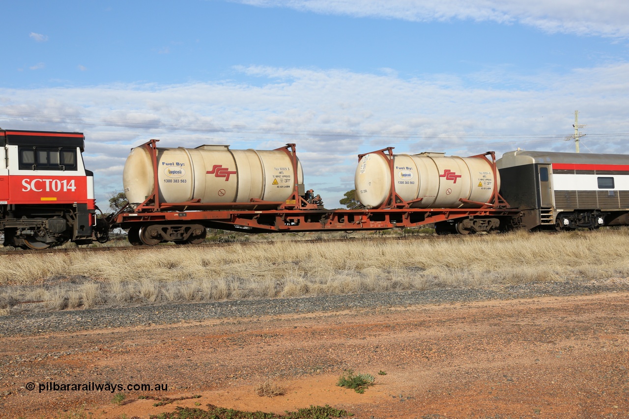 130710 1007
Parkeston, SCT train 3PG1 fuel pod waggon PQFY 3055 with two AMT5 type SCT-Logicoil 32,000 litre fuel tanktainers TILU 102029 and TILU 102024. PQFY 3055 was built by Carmor Engineering SA in 1976 as an RMX flat waggon, recoded to AQMY, then reclassed to RQMY in 1994.
Keywords: PQFY-type;PQFY3055;Carmor-Engineering-SA;RMX-type;AQMY-type;RQMY-type;