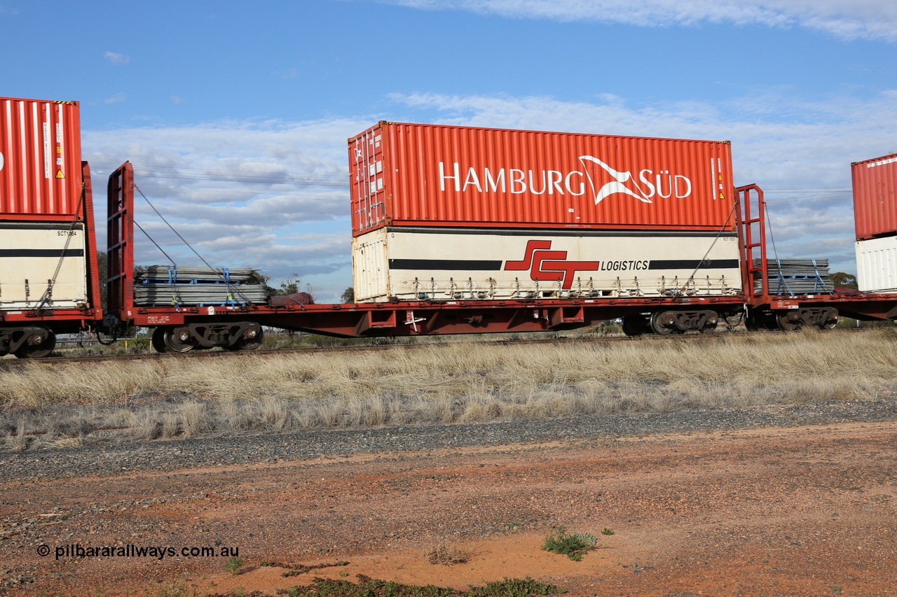 130710 1011
Parkeston, SCT train 3PG1 operating from Perth to Melbourne, PQCY 657 was originally built by Victorian Railways Newport Workshops in 1971 as one of two hundred FQX type 60' 3TEU container flat waggons, it was recoded to VQCX before private ownership and reclassed PQCY type. PQCY 657 is now fitted with bulkheads and here loaded its own gates, and an SCT half height curtain sider 40' container SCT 1033 double stacked with Hamburg Sud 40' 45G1 type container HASU 404941.
Keywords: PQCY-type;PQCY657;Victorian-Railways-Newport-WS;FQX-type;VQCY-type;