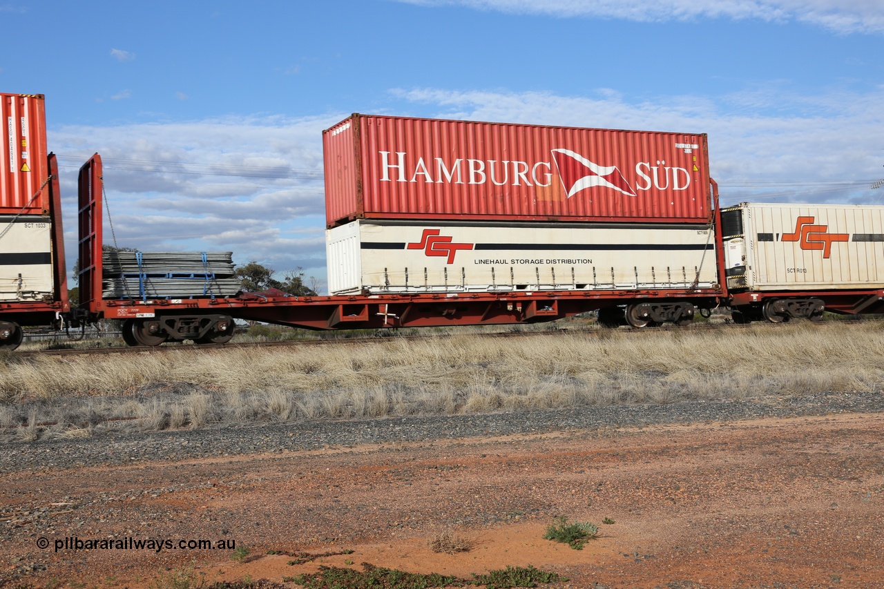 130710 1012
Parkeston, SCT train 3PG1 operating from Perth to Melbourne, PQCY 777 was originally built by Victorian Railways Newport Workshops in 1973 as one of one hundred and twenty five FQX type 60' 3TEU container flat waggons, it was recoded to VQCX in 1980, then to National Rail in November 1994 as RQCX before private ownership and reclassed PQCY type. PQCY 777 is now fitted with bulkheads and here loaded its own gates, and an SCT half height curtain sider 40' container SCT 1009 double stacked with Hamburg Sud 40' 45G1 type container HASU 574817.
Keywords: PQCY-type;PQCY777;Victorian-Railways-Newport-WS;FQX-type;VQCX-type;RQCX-type;