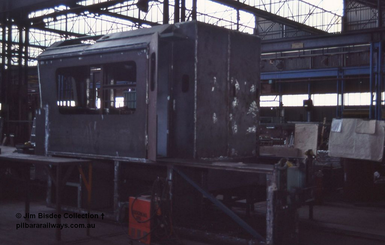 1047 001
Welshpool, Goninan Open Day 27th August, 1988. Brand new Pilbara cab being constructed for GE CM39-8 locomotive 5633 serial 5831-12 / 88-082 under construction for Mt Newman Mining.
Jim Bisdee photo.
Keywords: 5633;Goninan;GE;CM39-8;5831-12/88-082;