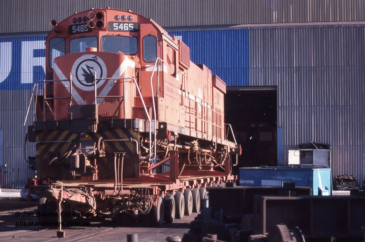 1061 001
Welshpool, Goninan, Mt Newman Mining's AE Goodwin built ALCo C636 model 5465 serial G6041-1 sits on a road transport float out the front of the workshops, this unit went on to be rebuilt into a GE C36-7M unit 5512. December 1987.
Jim Bisdee photo.
Keywords: 5465;AE-Goodwin;ALCo;C636;G6041-1;