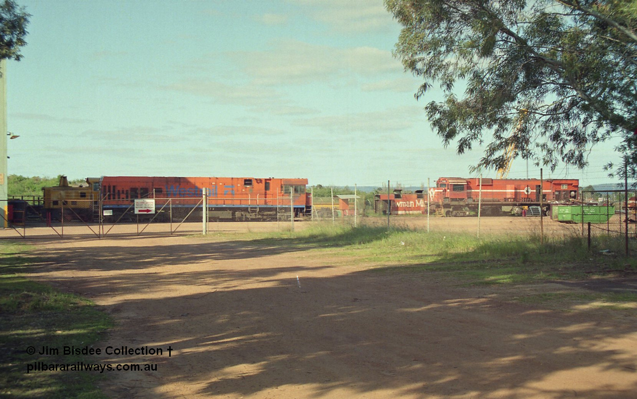 16947
Bassendean, an overview of the rear of Goninan's workshops, Westrail P class and Mt Newman Mining's AE Goodwin built ALCo M636 unit 5480 serial G6061-1 being prepped for rebuilding into 5658. October 1993.
Jim Bisdee photo.
Keywords: 5480;AE-Goodwin;ALCo;M636C;G6061-1;