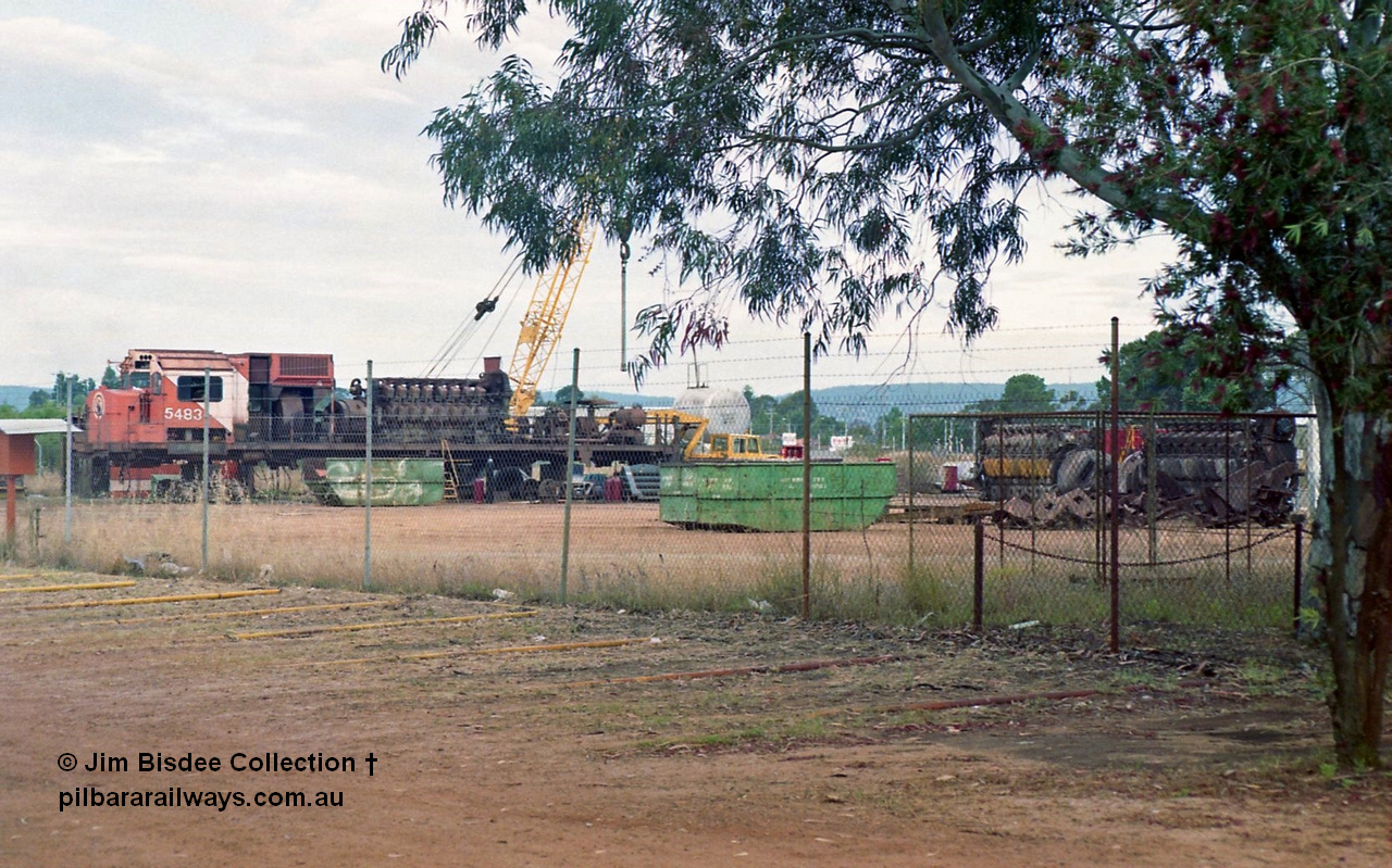 16954
Bassendean, the rear of Goninan's workshops, Mt Newman Mining's AE Goodwin built ALCo M636 unit 5483 serial G6061-4 being prepped for rebuilding into 5659 with the 251 engine and alternator visible and other 251's to the right. October 1993.
Jim Bisdee photo.
Keywords: 5483;AE-Goodwin;ALCo;M636C;G6061-4;
