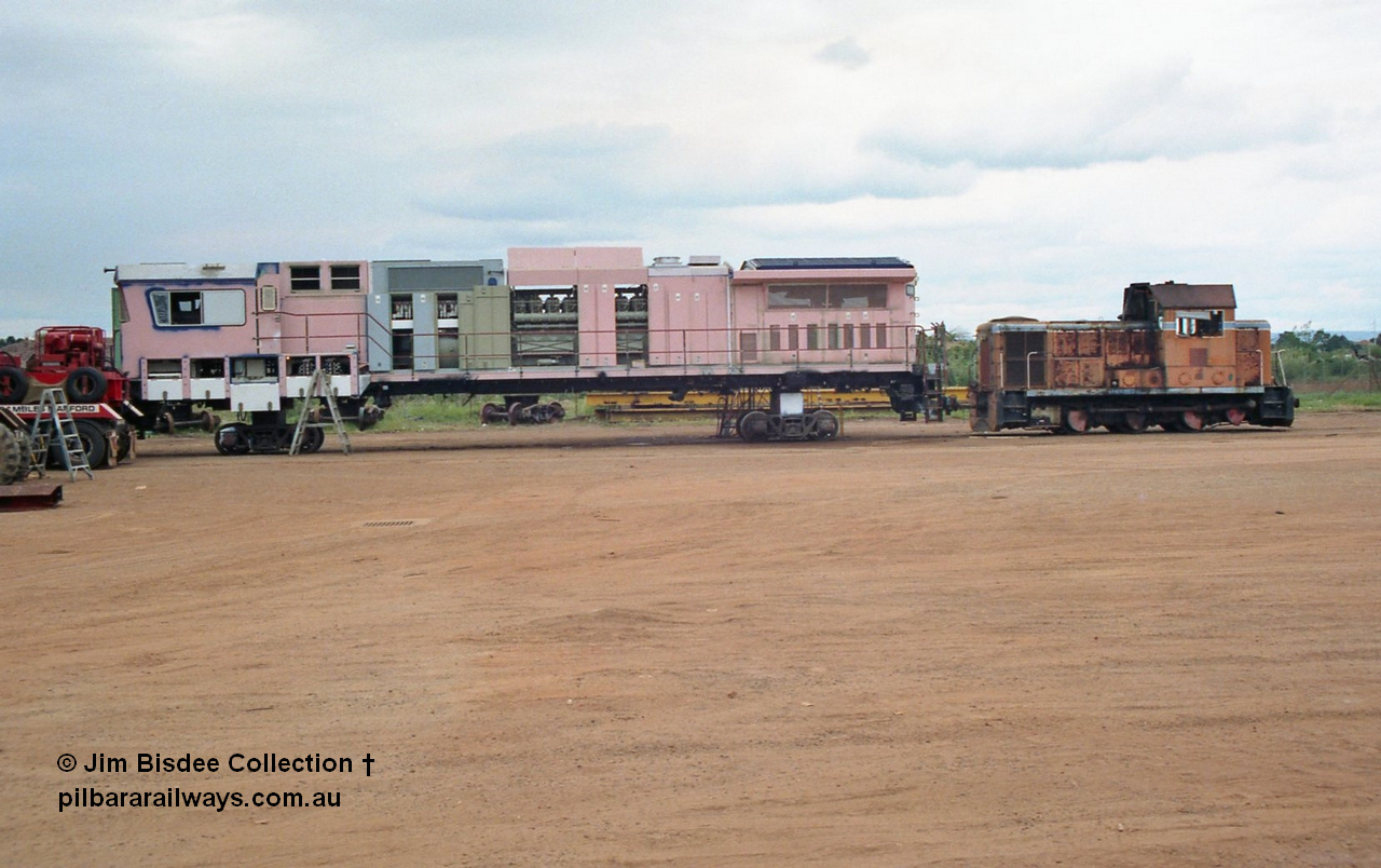 22453
Bassendean, Goninan workshops, partially built BHP Iron Ore GE CM40-8M unit, possibly 5645 coupled to the 'on loan' ARHS ex WAGR B class shunt loco. November 1992.
Jim Bisdee photo.
Keywords: Goninan;GE;CM40-8M;