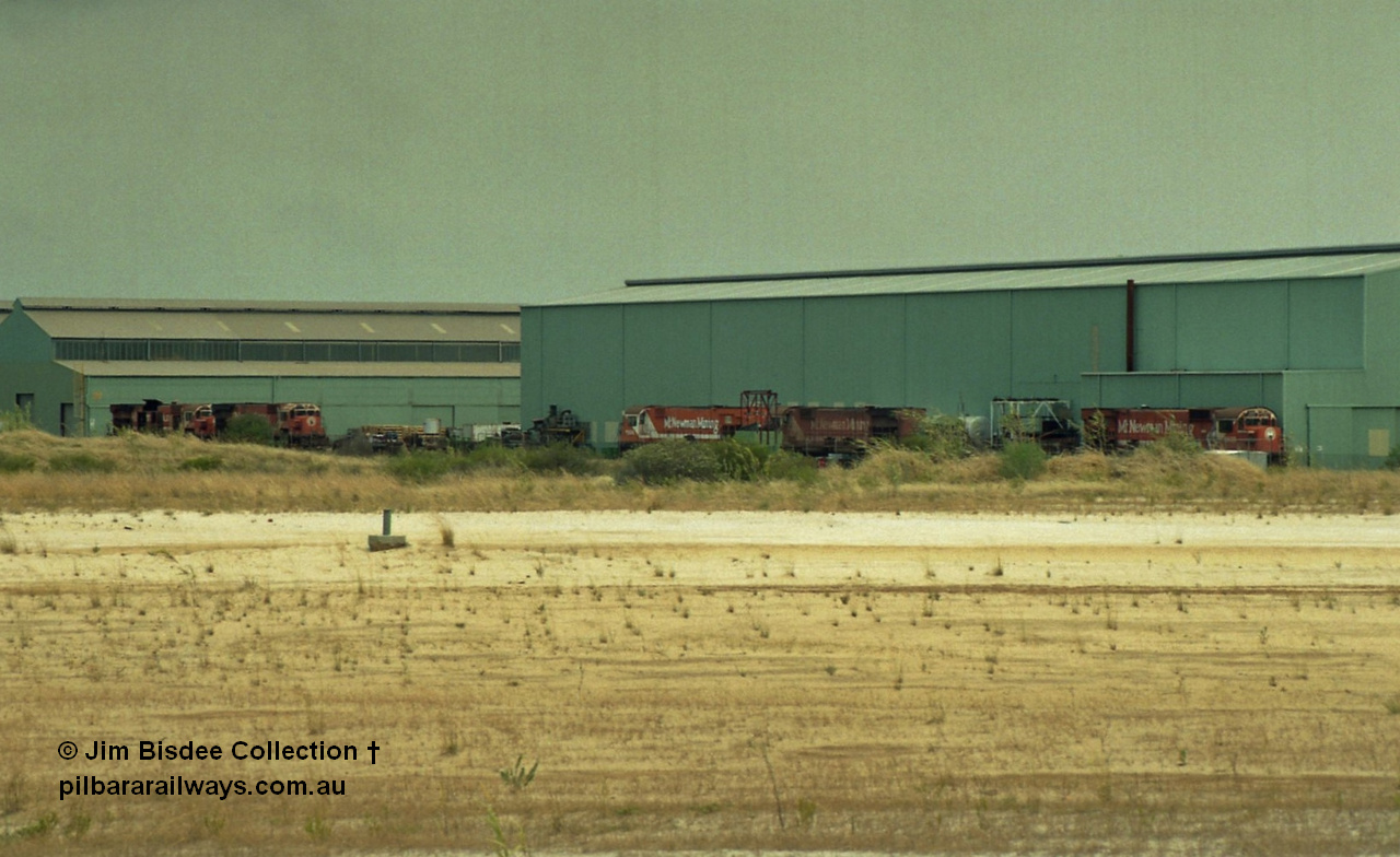 22928
Bassendean, Goninan workshops, view of several Mt Newman Mining ALCo units awaiting rebuilding or scrapping. November 1992.
Jim Bisdee photo.
