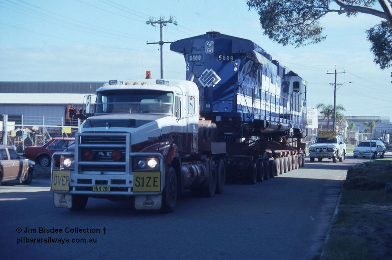 3584 001
Bassendean, Wood St, delivery of the final BHP CM40-8MEFI unit 5669 'Beilun' serial 8412-02 / 95-160. Unit was rebuilt as one of three with an electronic fuel injected prime mover by Goninan from Comeng built ALCo M636 unit 5486 serial C6084-2. Date July 1995.
Jim Bisdee photo.
Keywords: 5669;Goninan;GE;CM40-8EFI;8412-02/95-160;rebuild;Comeng-NSW;ALCo;M636C;5486;C6084-2;