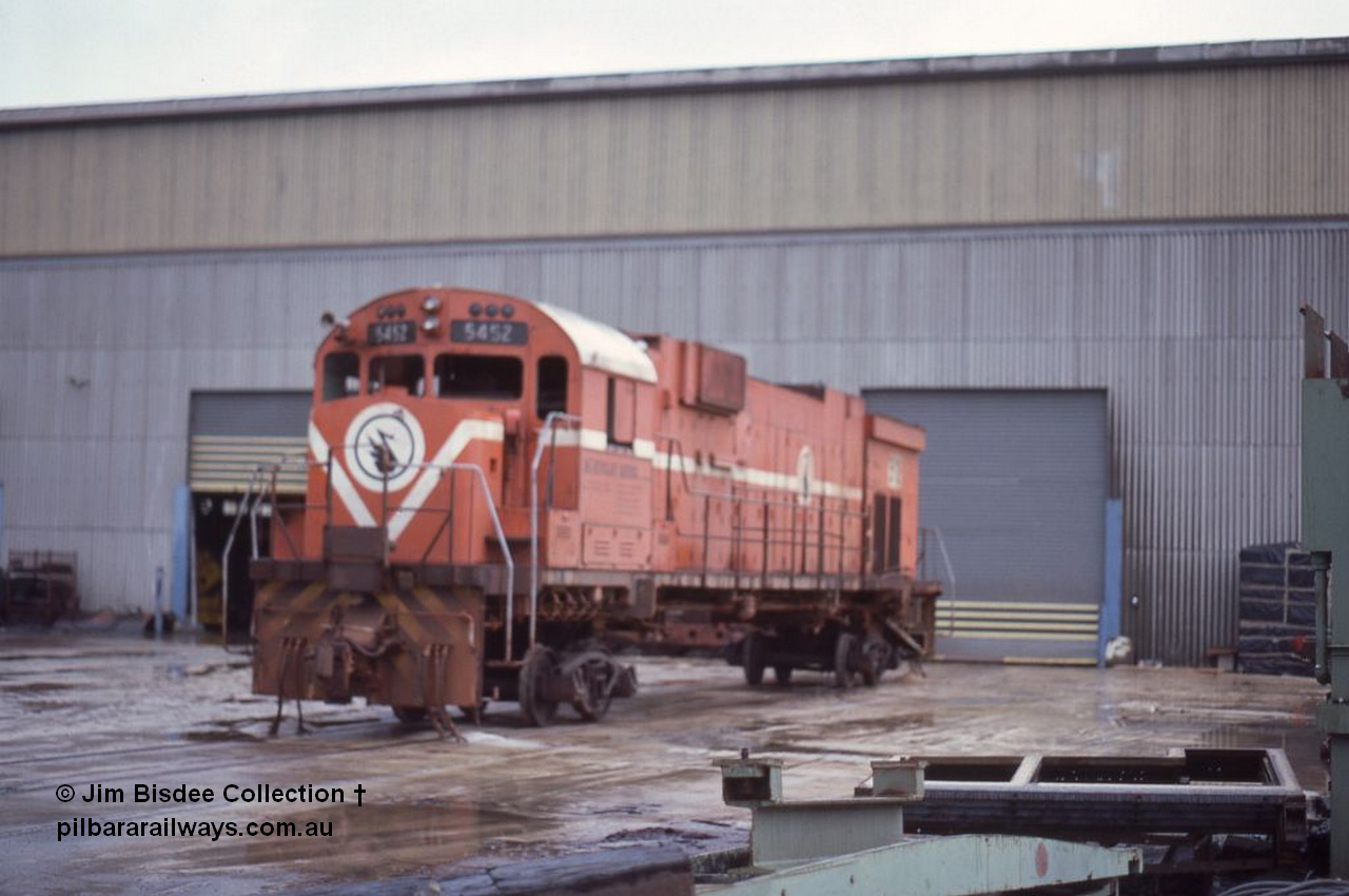 5942 001 Welshpool 1986Sept
Welshpool, Goninan workshops, Mt Newman Mining C636 ALCo unit 5452 serial G6012-1 built by AE Goodwin in May 1968 is undergoing a world first as it gets rebuilt into a GE C36-7M locomotive. In the September 1986 view the process has started and it is on shop bogies, by July 1987 it would become 5509. Sept 1986.
Jim Bisdee photo.
Keywords: 5452;AE-Goodwin;ALCo;C636;G6012-1;