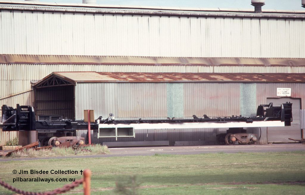 6998 001
Welshpool, Goninan workshops, a newly build frame for a Mt Newman Mining GE model CM39-8 sits upside down on shop bogies. Late 1998.
Jim Bisdee photo.
Keywords: Goninan;GE;CM39-8;