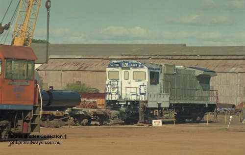 16942
Bassendean, Goninan GE CM40-8M rebuild unit for BHP Iron Ore 5653 'Chiba' serial 8412-10 / 93-144 sits out the back on shop bogies still under construction in the October 1993 image as Westrail P class loco P 2014 looks on.
Jim Bisdee photo.
Keywords: 5653;Goninan;GE;CM40-8M;8412-10/93-144;rebuild;AE-Goodwin;ALCo;M636C;5484;G6061-5;