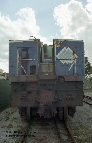 19800
Bassendean, Goninan workshops, former BHP Iron Ore Goninan GE rebuild C36-7M unit 5509, seen here stripped down to being an engine test bed, front on view of cab remains. Sept 2003.
Jim Bisdee photo.
Keywords: 5509;Goninan;GE;C36-7M;4839-05/87-074;rebuild;AE-Goodwin;ALCo;C636;5452;G6012-1;