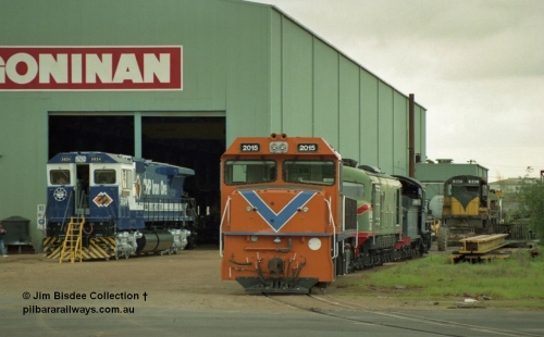 22648
Bassendean, Goninan workshops, brand new GE CM40-8M rebuild unit for BHP Iron Ore 5634 'Boodarie' serial 8151-07 / 91-120 looks to be in the final stages of construction as it sits out side with Westrail P class GE model CM25-8 unit P 2015 serial 6320-01 / 91-100 and a Robe River ALCo in the background during an Open Day on 20th July 1991.
Jim Bisdee photo.
Keywords: 5634;Goninan;GE;CM40-8M;8151-07/91-120;rebuild;AE-Goodwin;ALCo;C636;5457;G6027-1;