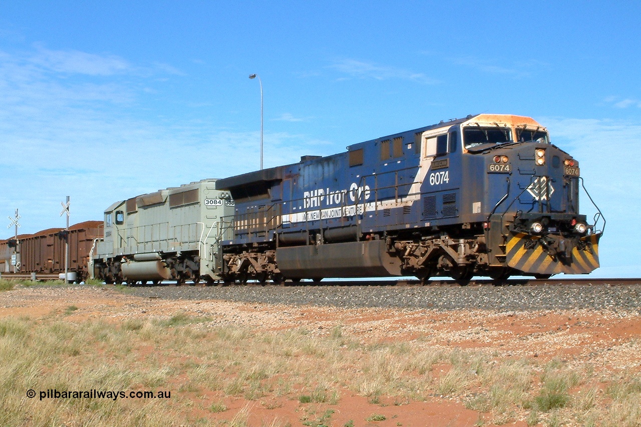 040502 091608r
Bing Siding, BHP GE AC6000 6074 'Kalgan' serial 51066 leading EMD SD40-2 3084 serial 786263-35 originally Union Pacific UP 3643 at the 15.4 km grade crossing with a loaded Yandi train 2nd May 2004.
Keywords: 6074;GE;AC6000;51066;