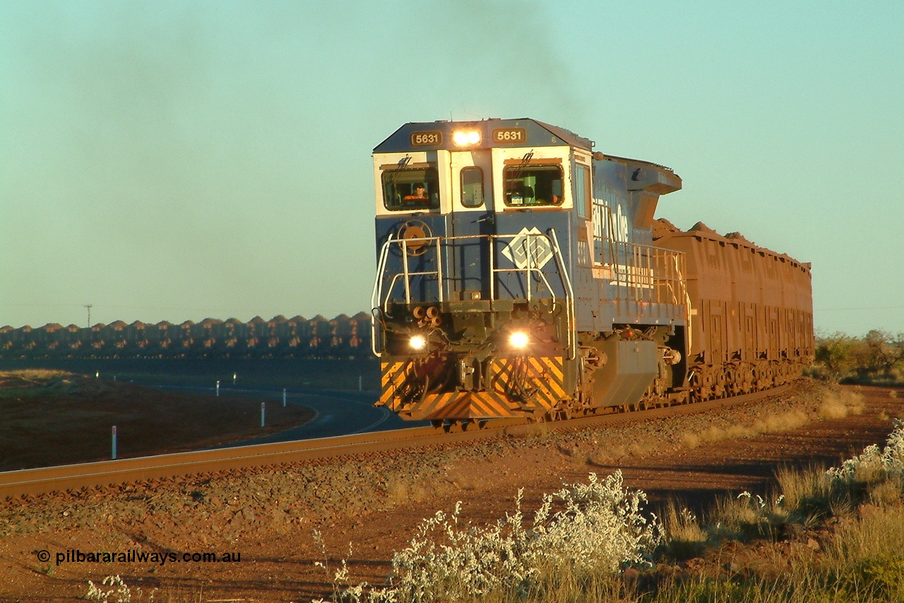 040801 172236r
Boodarie, 5631 'Apollo' serial 5831-10 / 88-080 leading a loaded Yarrie train thunders around the curve between Boodarie Yard and Finucane Island bound for the FI rotary dumper at 1722 hrs 1st August 2004.
Keywords: 5631;Goninan;GE;CM39-8;5831-10/88-080;