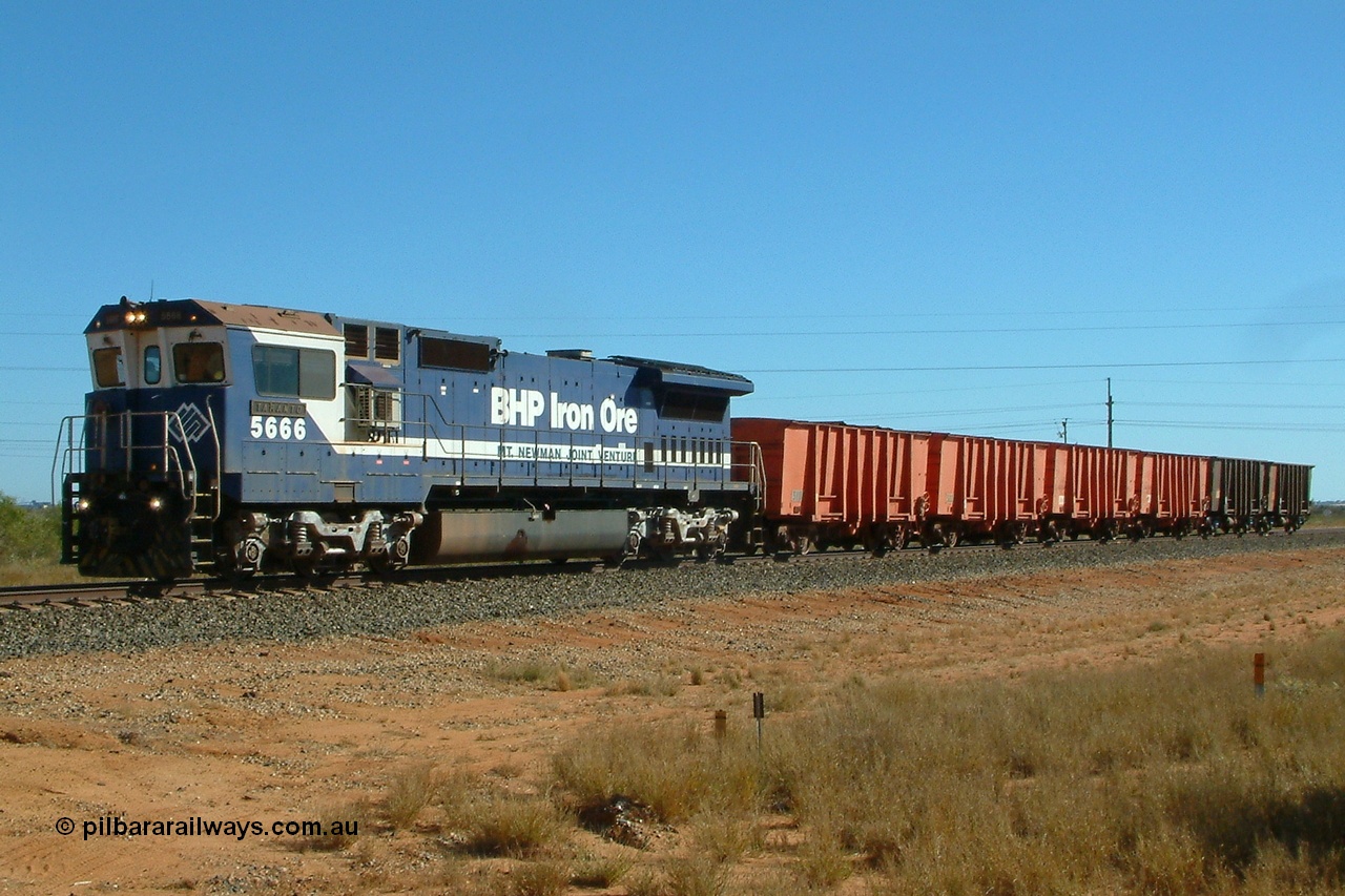 040806 091254r
Goldsworthy Junction, BHP Goninan GE rebuild CM40-8MEFI 5666 'Taranto' serial 8412-11 / 94-157, was the first unit fitted with Electronic Fuel Injection to the 16FDL engine hence the EFI on the model designation, is in charge of the Weighbridge Calibration train which is situated in the middle of the switches at the Goldsworthy Junction. 5666 will do several trips back and forward over the weighbridge at various speed to allow the technicians to calibrate it as well as having to clear the mainline for loaded and empty train movements. 0915 hrs 6th August 2004.
Keywords: 5666;Goninan;GE;CM40-8MEFI;8412-11/94-157;rebuild;Comeng-NSW;ALCo;M636C;5487;C6084-3;