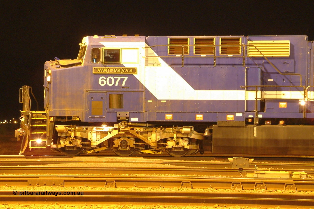 040807 024920r
Nelson Point, BHP GE AC6000 6077 'Nimingarra' serial 51069 idles away 0250 hrs on the loco spur near the South Yard Loco Prep facility 7th August 2004.
Keywords: 6077;GE;AC6000;51069;