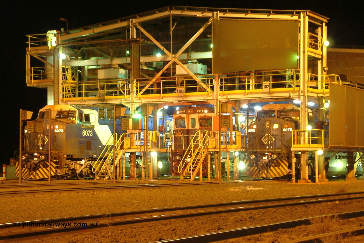 040807 025404r
Nelson Point, BHP's South Yard Locomotive Prep Shed holds GE AC6000 units 6073 'Fortescue' serial 51065 and 6075 'Newman' serial 51067 with Goninan rebuild CM40-8M unit 5648 'Kwangyang Bay' serial 8412-06/93-139 on the night shift, 7th August 2004. This facility has since been demolished.
Keywords: 6073;GE;AC6000;51065;