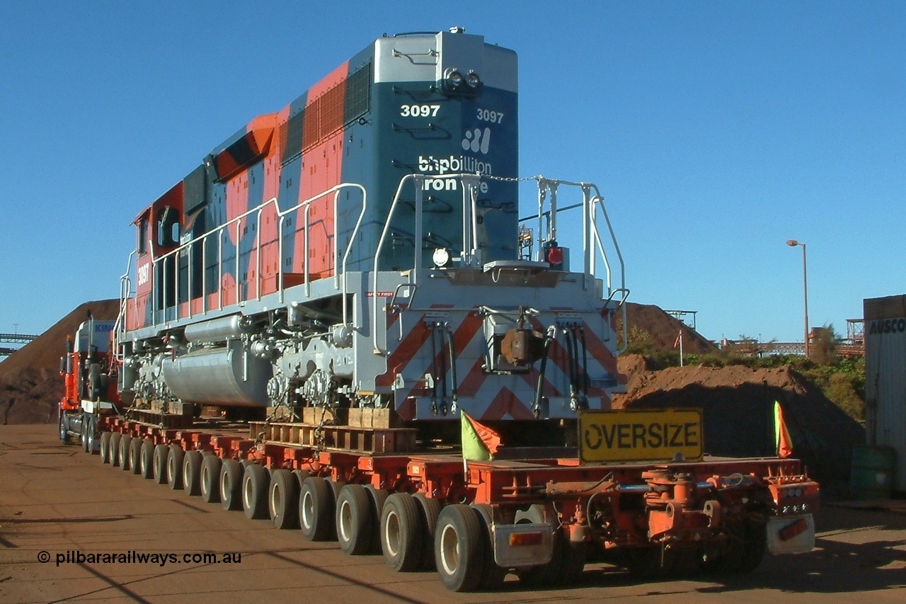 040807 082350r
Port Hedland, Gilbert Street, EMD SD40R unit 3097 serial 31569 and originally Southern Pacific SD40 SP 8409 is the final member of the SD40 units and is being road delivered by Kingston Heavy Haulage 168 wheel float into BHP Nelson Point via Gate 9 7th August 2004.
Keywords: 3097;EMD;SD40R;31569/7875-10;SD40;SP8409;