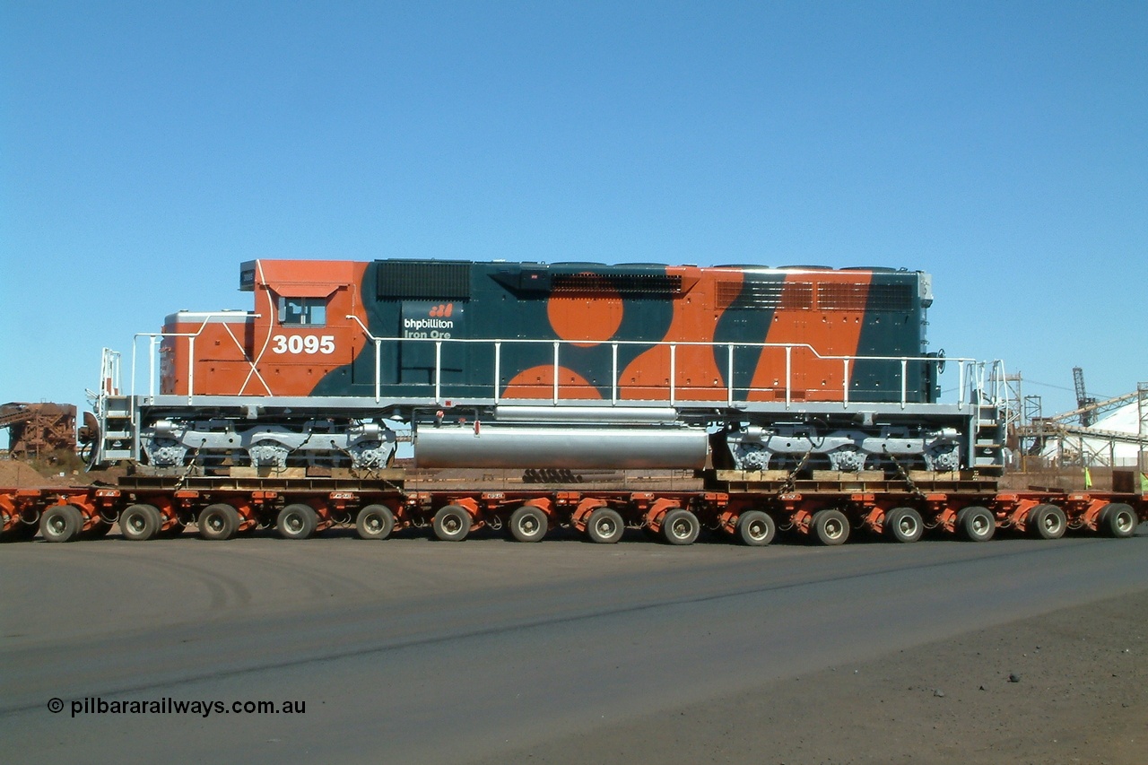 040807 112646r
Port Hedland, Gilbert Street, BHP Billiton EMD SD40R unit 3095 serial 33677 originally Southern Pacific SD40 SP 8485 being road delivered by Kingston Heavy Haulage on a 168 wheel float as it turns into Gate 9 for Nelson Point 7th August 2004.
Keywords: 3095;EMD;SD40R;33677/7083-7;SD40;SP8485;