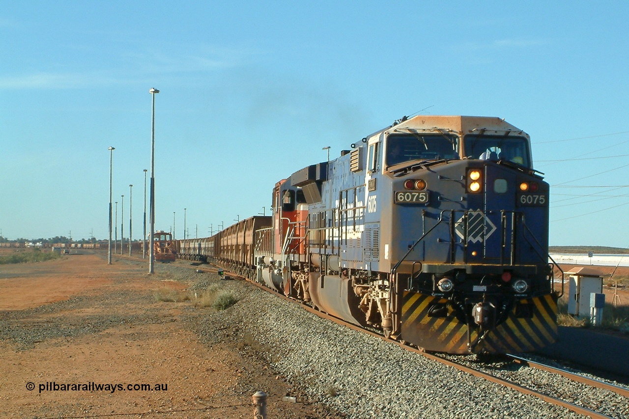 040809 162852r
Nelson Point, BHP GE AC6000 6075 'Newman' serial 51067 and EMD SD40R 3090 serial 33680 originally Southern Pacific SD40 SP 8488 depart the yard with the 1630 hrs departure on 9th August 2004. The mid-train units 5660 and 5656 can be just seen in picture.
Keywords: 6075;GE;AC6000;51067;