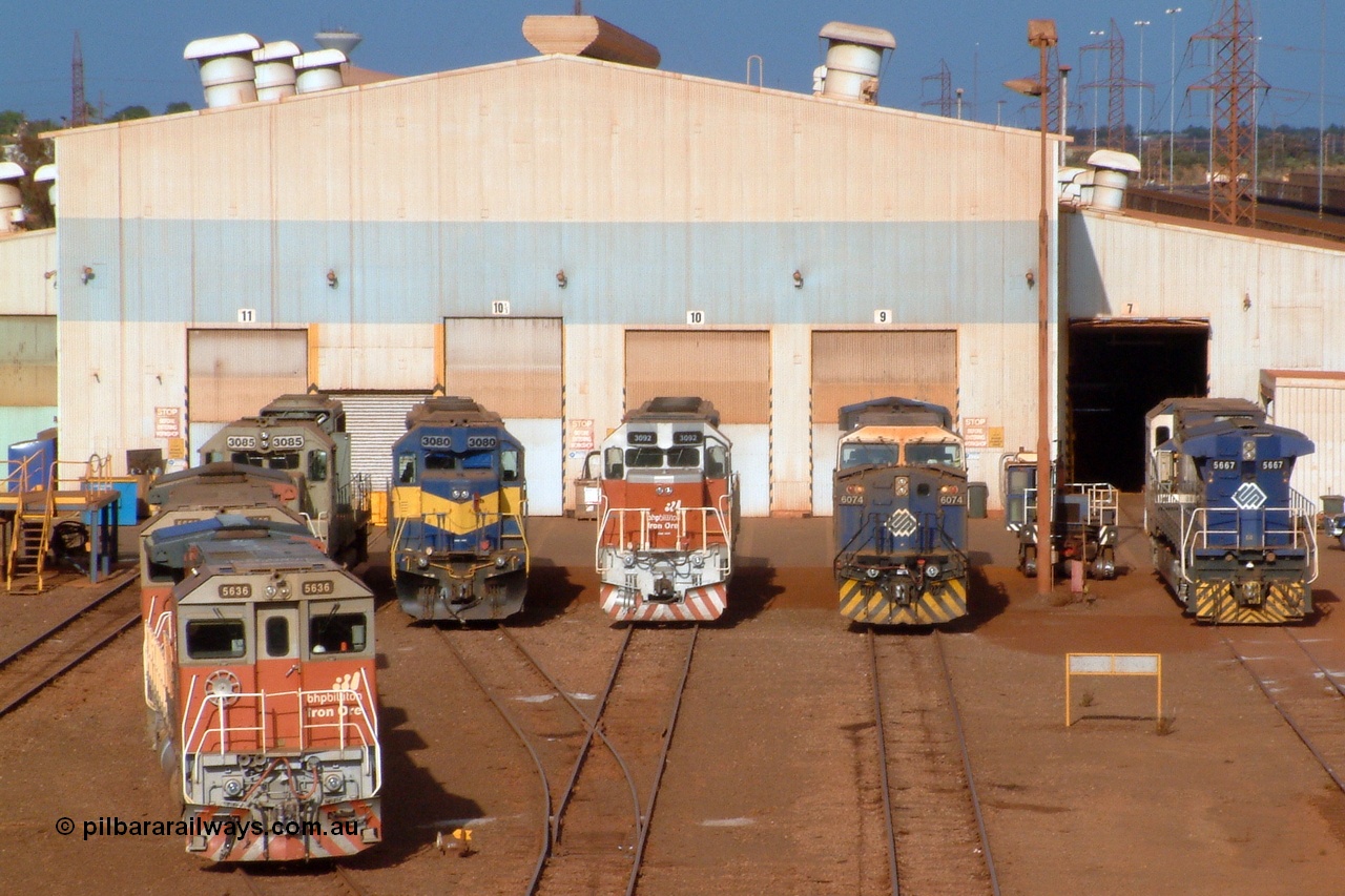 041119 163700r
Nelson Point, this Pilbara Power Parade shot shows all current liveries used by BHP Billiton. From the undercoat on 3085, the IC&E blue and yellow on 3080, the old corporate colours of BHP, blue and white, on 6074 and 5667 and the new Steve Malpass designed 'bubble' scheme, shown here on units 3092, 5639 and 5636. 19th of November 2004.
