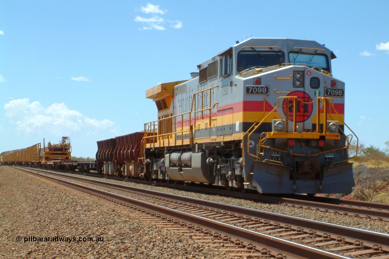 050110 135546r
Ibis Siding, the highest numbered Hamersley Iron owned General Electric built Dash 9-44CW unit 7098 serial 54161 from the fourth order in 2003 in the Pilbara Rail livery leads a works train of ballast and rail waggons into the passing track to meet a loaded train. 10th January 2005.
Keywords: 7098;GE;Dash-9-44CW;54161;