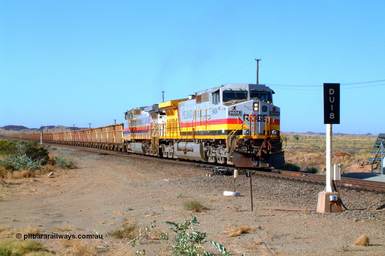 050110 164122r
Dugite Siding at the 64 km on the Dampier line, Robe River owned General Electric built Dash 9-44CW unit 9404 serial 54154 in Pilbara Rail livery leads Hamersley Iron owned and liveried Dash 9-44CW unit 7079 serial 47758 with an empty train as it pulls back onto the mainline after crossing a loaded. Monday 10th January 2005.
Keywords: 9404;GE;Dash-9-44CW;54154;