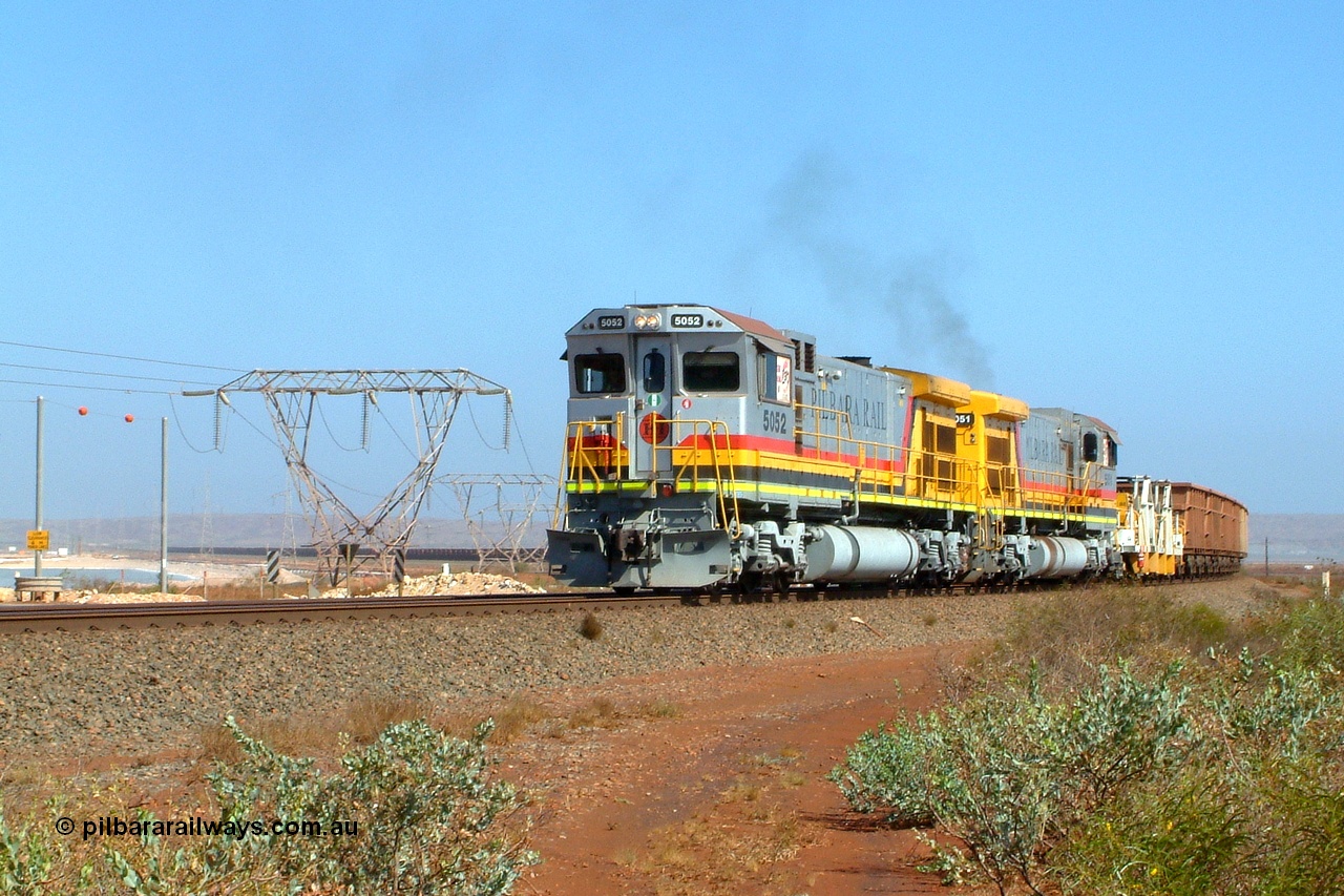 050111 090411r
Seven Mile, Goninan ALCo to GE rebuild C36-7M units 5052 'Ben' serial 4839-04 / 87-073 and 5051 'Bill' serial 4839-03 / 87-072 lead an empty consist across Anchovy Flats from Parker Point. Tuesday 11th January 2005. These two locos started life as ALCo C636 units for Mt Newman Mining, then rebuilt by Goninan for BHP into the C36-7M, upon retiring Goninan overhauled them and they have been in service at Seven Mile for eight years and are still stored there.
Keywords: 5052;Goninan;GE;C36-7M;4839-04/87-073;rebuild;AE-Goodwin;ALCo;C636;5466;G6041-2;5508;