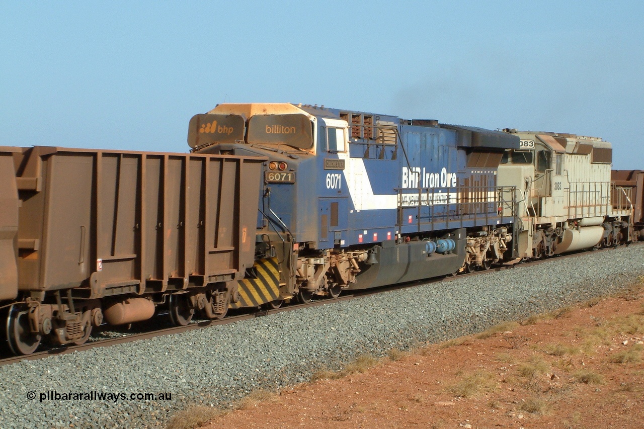 050204 080155r
Mooka, BHP mid train units of GE AC6000 6071 'Chichester' serial 51063 with the metal windscreen protecting blinds up and EMD SD40-2 unit 3083 serial 786170-2 originally Union Pacific UP 3500 at close to line speed of 80 kph/h at the 30 km, 4th February 2005.
Keywords: 6071;GE;AC6000;51063;