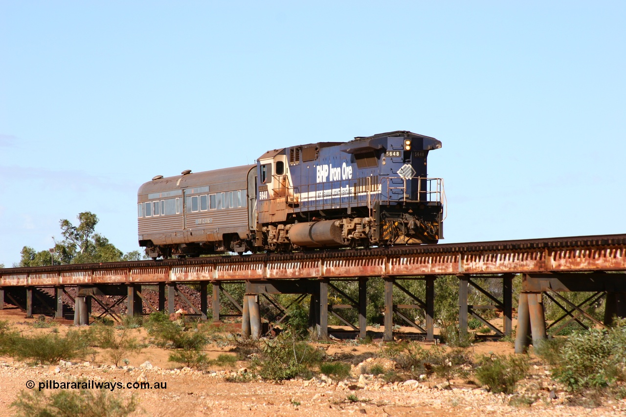 050625 3788
Tabba Tabba Creek bridge at the 48 km on the GML sees BHP Goninan GE rebuilt model CM40-8M unit 5648 'Kwangyang Bay' serial 8412-06 / 93-139 long end leading the Sundowner on its return to Hedland 25th June 2005.
Keywords: 5648;Goninan;GE;CM40-8M;8412-06/93-139;rebuild;AE-Goodwin;ALCo;M636C;5477;G6047-9;