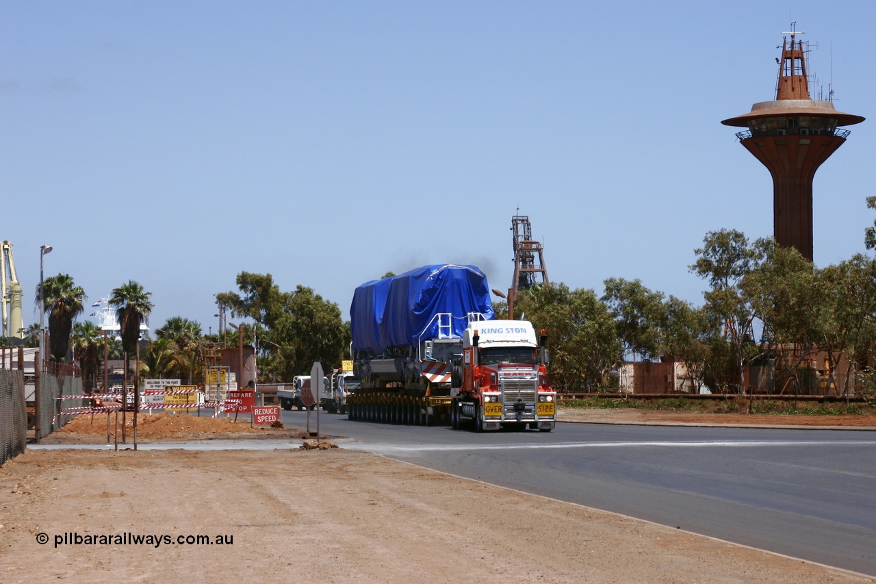 051022 5797r
Port Hedland port, BHP Billiton's first Electro-Motive SD70ACe to be off loaded in Australia 4311 serial 20038540-012 under tarp seen leaving the port en route to Nelson Point for unloading onto the rails 22nd October 2005.
Keywords: 4311;Electro-Motive-London-Ontario;EMD;20038540-012;