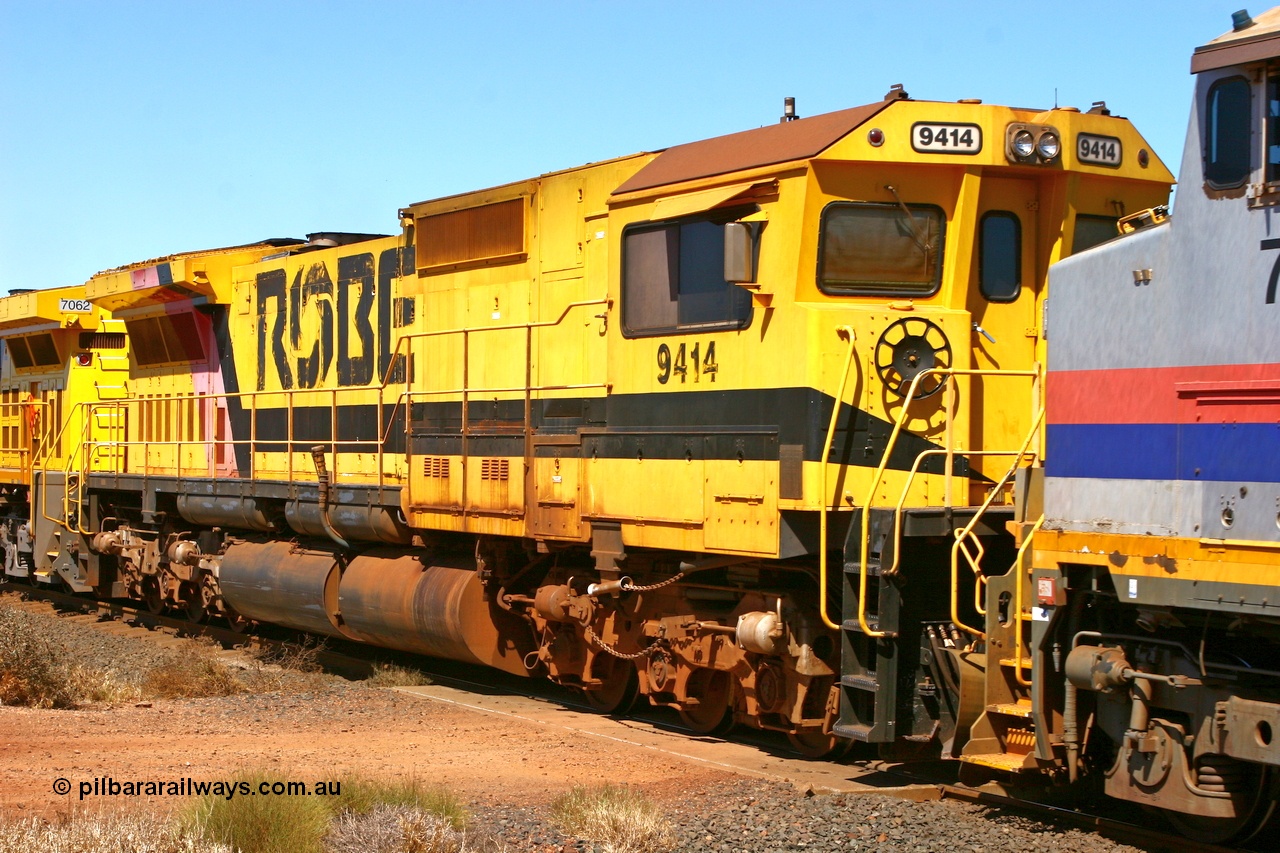 061209 8156r
Cape Lambert 11.7 km grade crossing, Robe River Goninan GE rebuilt CM40-8M loco 9414 serial 8206-11/91-124 still in service on the Deepdale line along with several others of the class in a quad lash up with three GE Dash 9-44CW units. 9th December 2006.
Keywords: 9414;Goninan;GE;CM40-8M;8206-11/91-124;rebuild;AE-Goodwin;ALCo;M636;G6060-5;