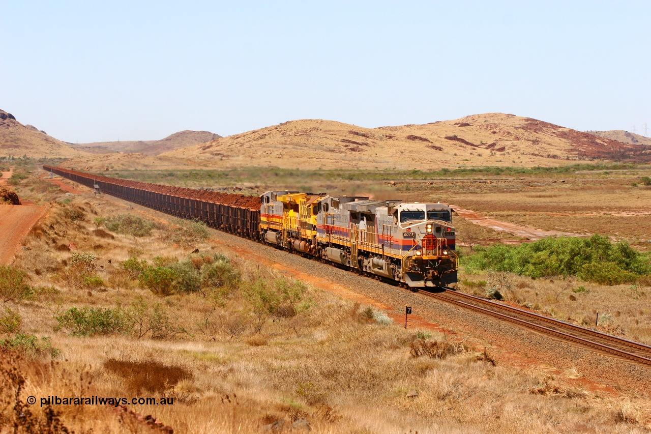 061209 8167r
Cape Lambert, 7 km finds Hamersley Iron General Electric built Dash 9-44CW unit 7077 serial 47756 leading sister 7088, Robe River GE rebuild CM40-8M 9414 and another HI Dash 9-44CW unit 7062 in Pilbara Iron livery with a loaded 207 waggon train from Deepdale. This area is now consumed by the Cape Lambert South Yard. 9th December 2006.
Keywords: 7077;GE;Dash-9-44CW;47756;