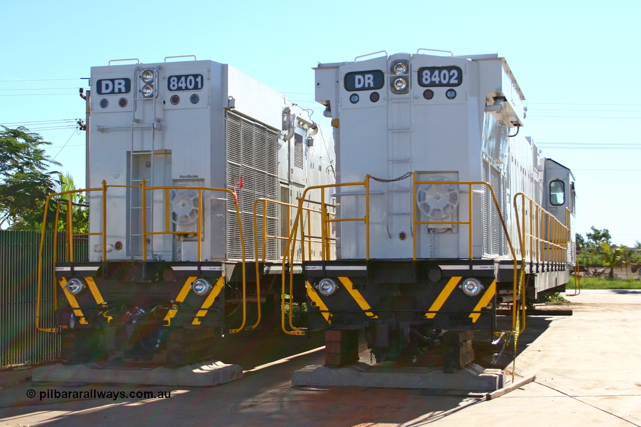 070501 9016r
Wedgefield, sitting in Asset Kinetics yard waiting to start construction duties are two of the four GTSA rebuilt DR class units. Comeng WA ALCo rebuild C636R model DR 8401 'Jean' serial WA143-1 and ex Robe River ALCo #9426 original serial 3499-02 and Comeng WA ALCo rebuild C636R model DR 8402 'Margaret' serial WA135 / C6011-02 and ex Hamersley Iron C636 #3007 with the differences between the Phase II and Phase III radiators of the Comeng WA ALCo rebuild models evident. 1st May 2007.
Keywords: DR-class;DR8401;Comeng-WA;C636R;WA143-1;9426;rebuild;ALCo;Schenectady-NY;C636;Conrail;6782;3499-3;