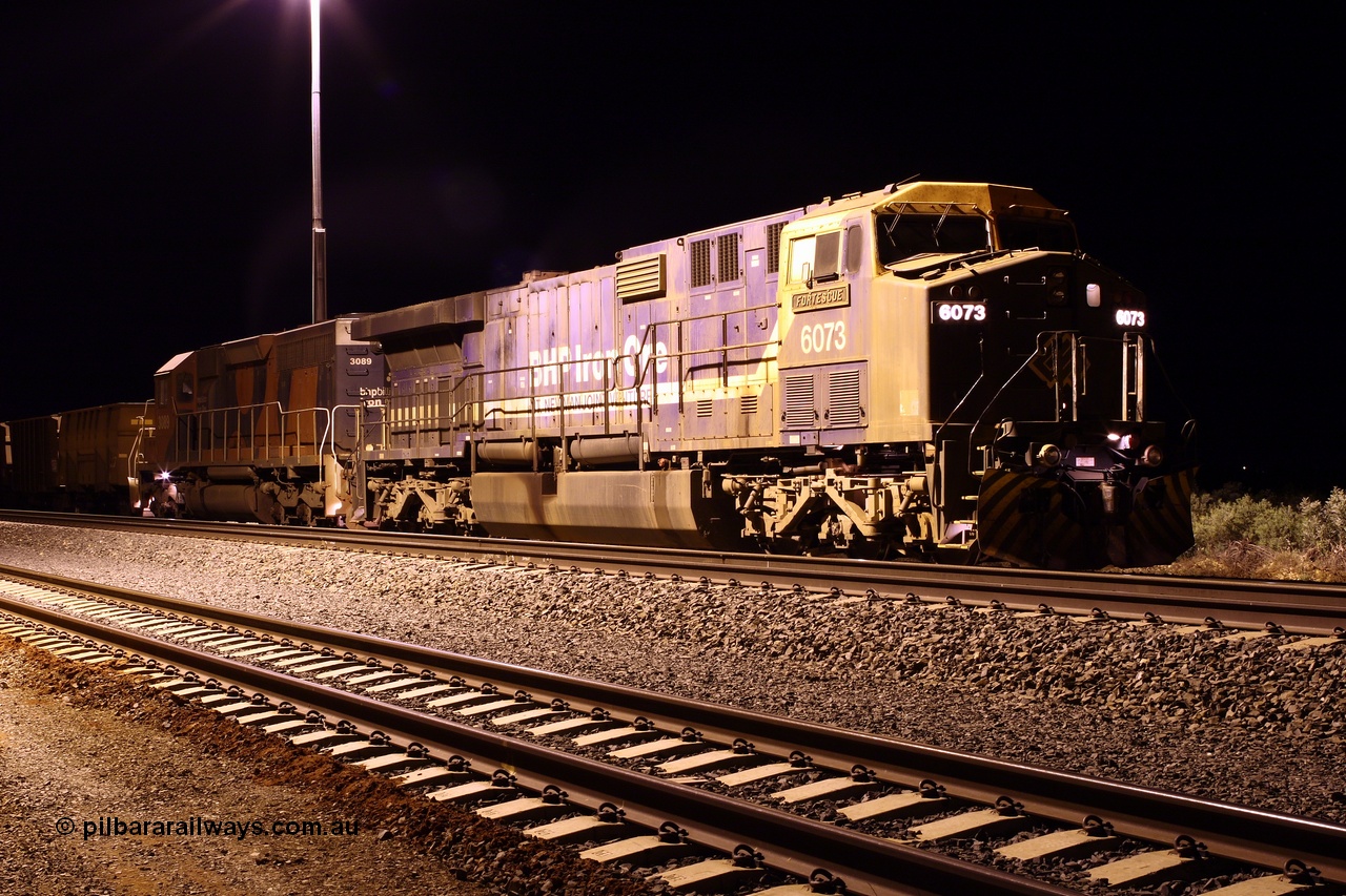 070823 0325r
Bing Siding, The David and Goliath of BHP Billiton's' motive power roster in the guise of GE AC6000 unit 6073 'Fortescue' serial 51065 and EMD SD40R unit 3089 serial 31512 originally Southern Pacific SD40 SP 8431 stand on the passing track waiting a run south to the mines 23rd August 2007.
Keywords: 6073;GE;AC6000;51065;