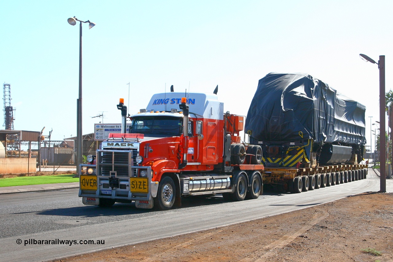 071101 1114r
Port Hedland, Gilbert Street, Kingston Transport leave the Hedland Port terminal with another FMG General Electric built Dash 9-44CW loco off the good ship BBC Kusan. Thursday 1st November 2007.
Keywords: GE;Dash-9-44CW;