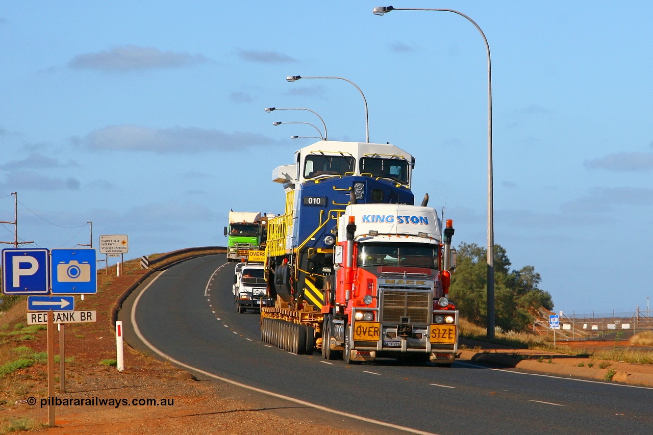 071101 1129r
Redbank Bridge Port Hedland, Kingston Transport's Mack brings FMG's General Electric built Dash 9-44CW loco 010 over the Redbank Bridge after stopping on the north side to remove the tarpaulin which had come loose. This was the only unit delivered minus the tarp. Thursday 1st November 2007.
Keywords: FMG-010;GE;Dash-9-44CW;58187;