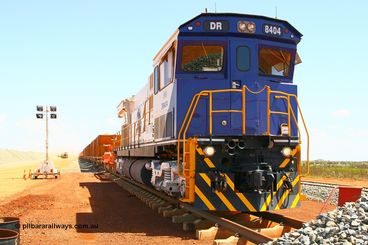 080118 1412r
Barker Siding, Comeng ALCo rebuild C636R model DR 8404 'Vera' serial WA135 / C6040-1 was rebuilt from Hamersley Iron 3013 an ALCo C636. Here it idles away on a ballast train during loading for the afternoon ballast run, DR 8403 is on the other end. 18th January 2008.
Keywords: DR8404;Comeng-WA;ALCo;C636R;WA135/C6040-1;