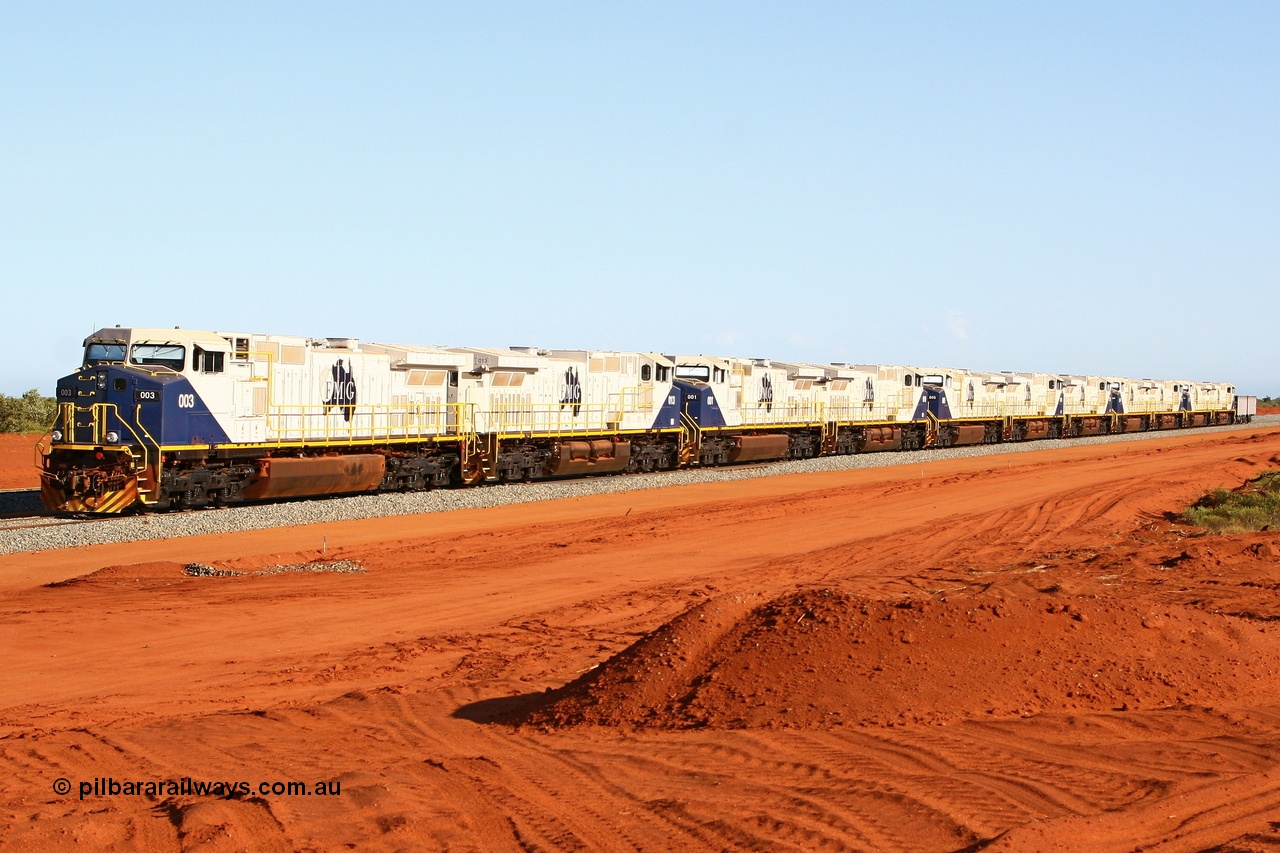 080120 1443r
Rowley Yard which was the name for FMG's marshalling facilities has eleven of the General Electric built Dash 9-44CW locomotives lined up, 003, 013, 001, 010, 005, 014, 007, 004, 015, 002 and 011 coupled to ore waggon pair 2264 - 1263, pointing south. 20th January 2008.
Keywords: FMG-003;GE;Dash-9-44CW;58180;