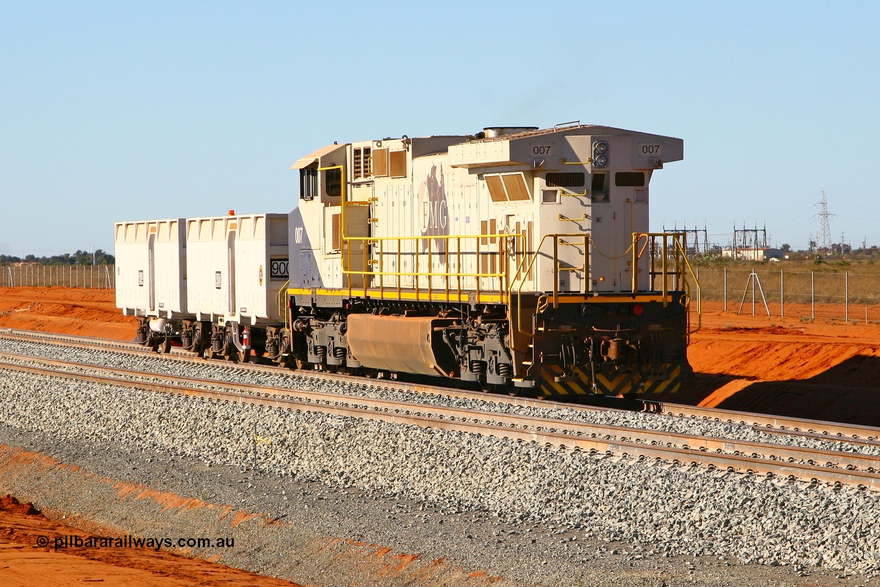 080525 2339r
Boodarie, sitting at the entry to Herb Elliot Port, FMG General Electric built Dash 9-44CW unit 007 serial 58184 shunts from the loaded waggon line with compressor waggon set 9003-9004. The loco will end up on the track in foreground as it shunts the compressor set on the empty waggon line. 25th May 2008.
Keywords: FMG-007;GE;Dash-9-44CW;58184;