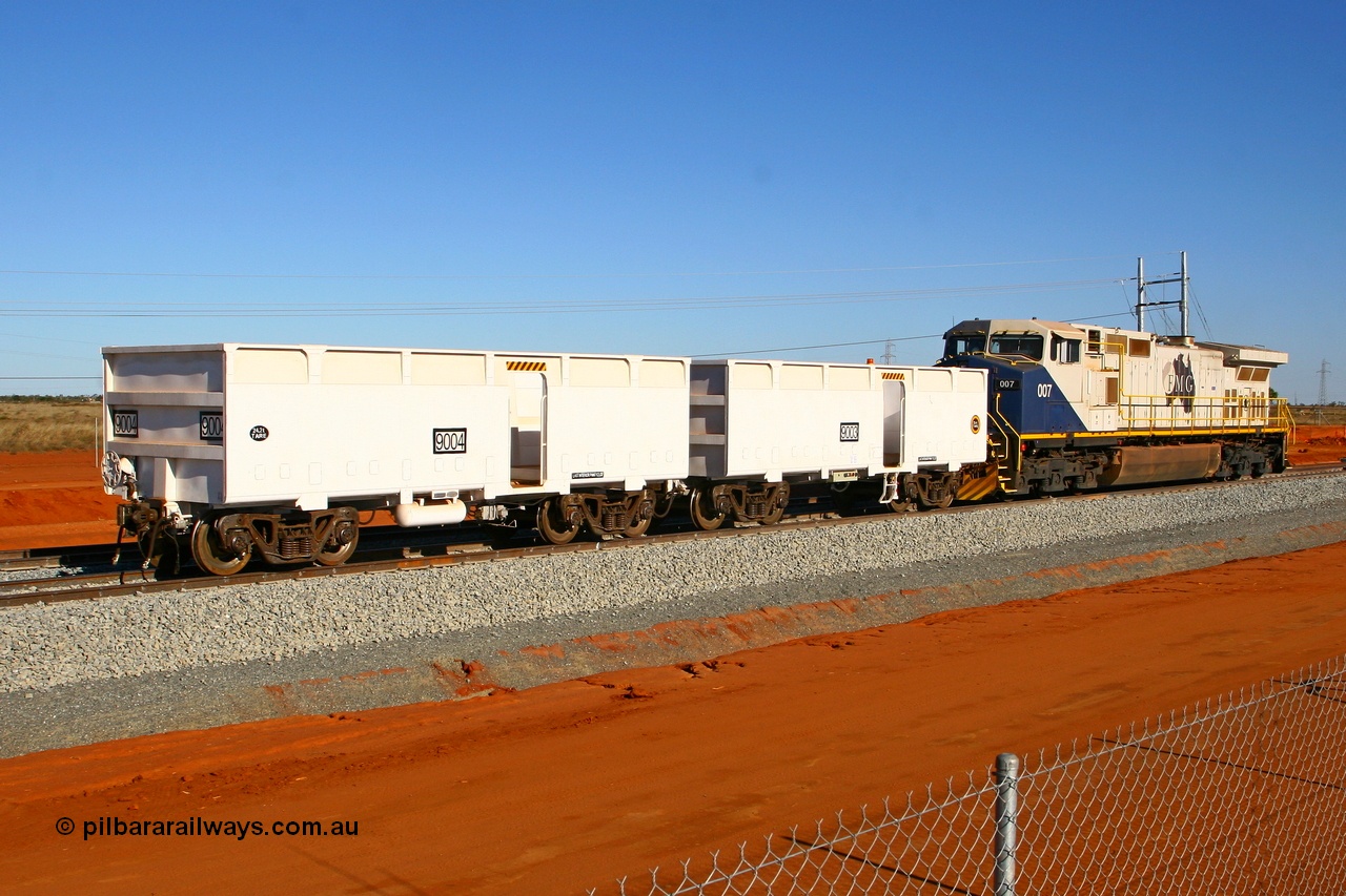 080525 2349r
Boodarie, FMG General Electric Dash 9-44CW unit 007 shunts compressor waggon set 9003-9004 onto the empty waggon line at the 4.400 km, which is the switch for the balloon unloading loop at the entrance to the Herb Elliot Port facility. 25th May 2008.
Keywords: FMG-007;GE;Dash-9-44CW;58184;