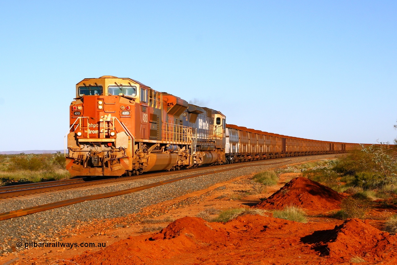 080621 2783r
Tabba Siding at the 83.4 km crossing, the final member of the original BHP Billiton order for thirteen Electro-Motive built SD70ACe/LC units 4313 serial 20038540-014 leads CM40-8M 5653 with a loaded 330 waggon train from Yandi 2 mine. Other locos in the consist are two set of mid train units consisting of CM40-8M-SD40R-SD40R and CM40-8-SD40R-SD40R. 21st June 2008.
Keywords: 4313;Electro-Motive;EMD;SD70ACe/LC;20038540-014;