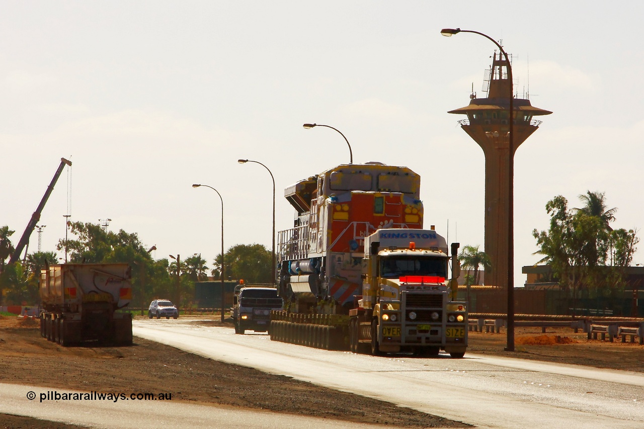 090113 0757
Port Hedland, brand new Electro-Motive built SD70ACe/LC unit 4345 serial 20078915-012 leaves the port of Port Hedland and heads for Nelson Point to put placed on rails. Kingston Transport provide the 128 wheel floats and prime movers. 13th January 2009.
Keywords: 4345;Electro-Motive;EMD;SD70ACe/LC;20078915-012;