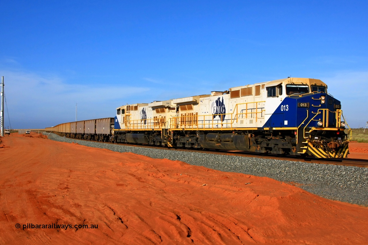 090121 1549r
Boodarie, departing the Herb Elliot car dumper balloon are FMG General Electric built Dash 9-44CW units 013 serial 58190 and 006 serial 58183 with 204 empty waggons bound for the passing track at Rowley Yard to cut out and add waggons. 21st January 2009.
Keywords: FMG-013;GE;Dash-9-44CW;58190