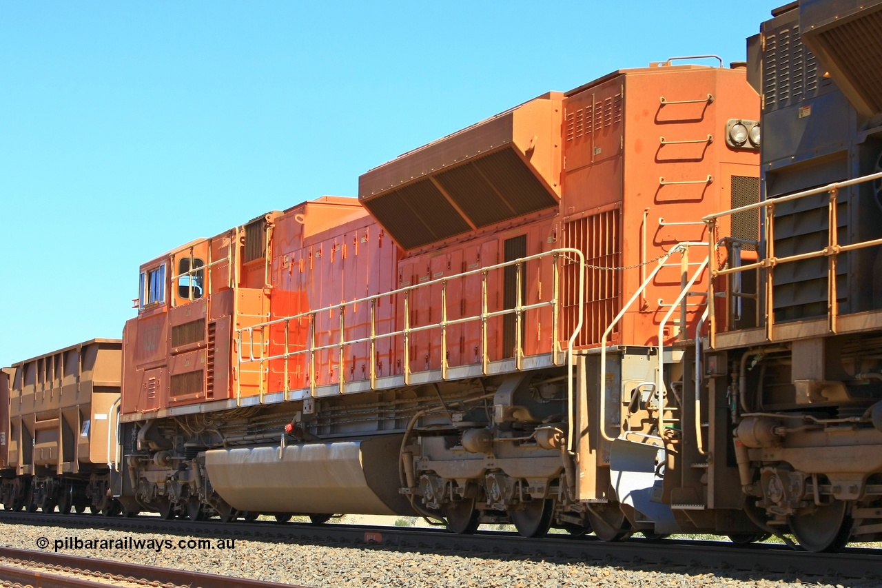 090814 2068r
Woodstock, BHP Billiton SD70ACe locomotive 4327 was built by Electro-Motive as an EMD model SD70ACe for the BNSF railroad in the USA with serial 20066862-056 but was sold to BHP while under construction as one of ten similar units to be diverted to BHP in an all over BNSF base orange earning them the nickname of 'pumpkins' after the BNSF livery. They were standard US domestic units and required substantial modifications to be afforded lead unit status for BHP. Here we some a couple of the modifications like the snow plough and the middle handrail and the windscreen protector is just visible. 14th August 2009.
Keywords: 4327;Electro-Motive-London-Ontario;EMD;SD70ACe;20066862-056;BNSF-9185;