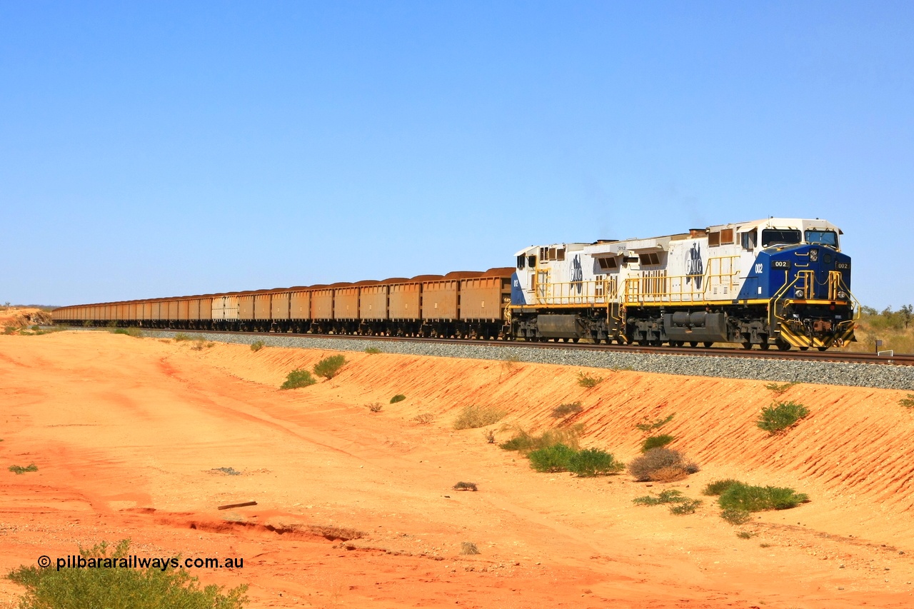 090814 2084r
Hunter Siding, FMG's General Electric Dash 9-44CW locomotives 002 serial 58179 and 012 serial 58189 leading 240 loaded waggons hold the mainline waiting to cross an empty train. 14th August 2009.
Keywords: FMG-002;GE;Dash-9-44CW;58179;