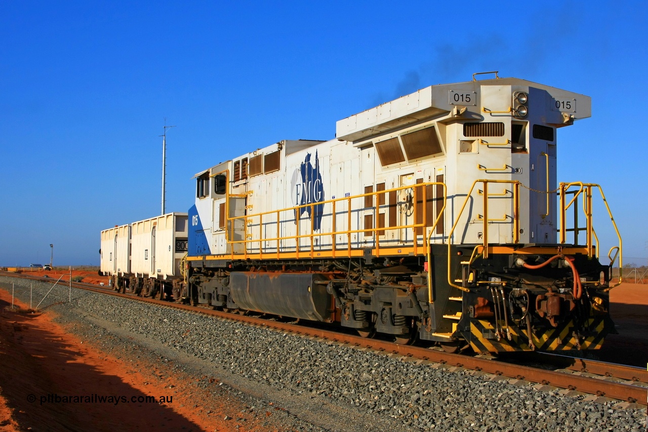 090912 2277r
Boodarie, at the entrance to the Herb Elliot port car dumper balloon loop the final unit of FMG's 15 General Electric built Dash 9-44CW locos 015 serial 58192 with compressor set 9003-9004 shunts from the loaded waggon line to the empty waggon line at the 4.2 km under Proceed Authority 57 to make way for the incoming loaded train. 12th September 2009.
Keywords: FMG-015;GE;Dash-9-44CW;58192;