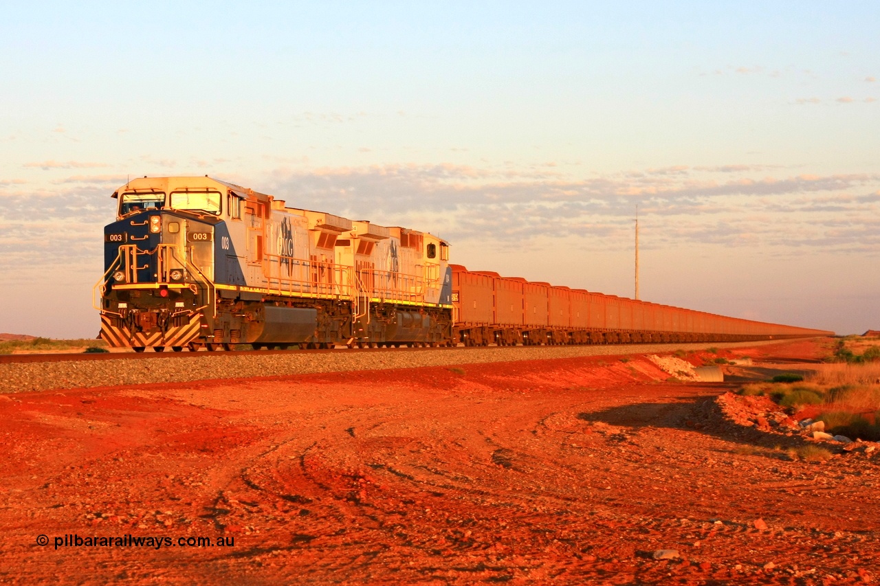 090912 2289r
Indee, at the 48.5 km grade crossing for Indee Road, FMG General Electric built Dash 9-44CW units 003 serial 58180 and 004 serial 58181 power another loaded train from the Cloud Break mine under Proceed Authority 54 in the last rays of sunlight on the 12th September 2009.
Keywords: FMG-003;GE;Dash-9-44CW;58180;